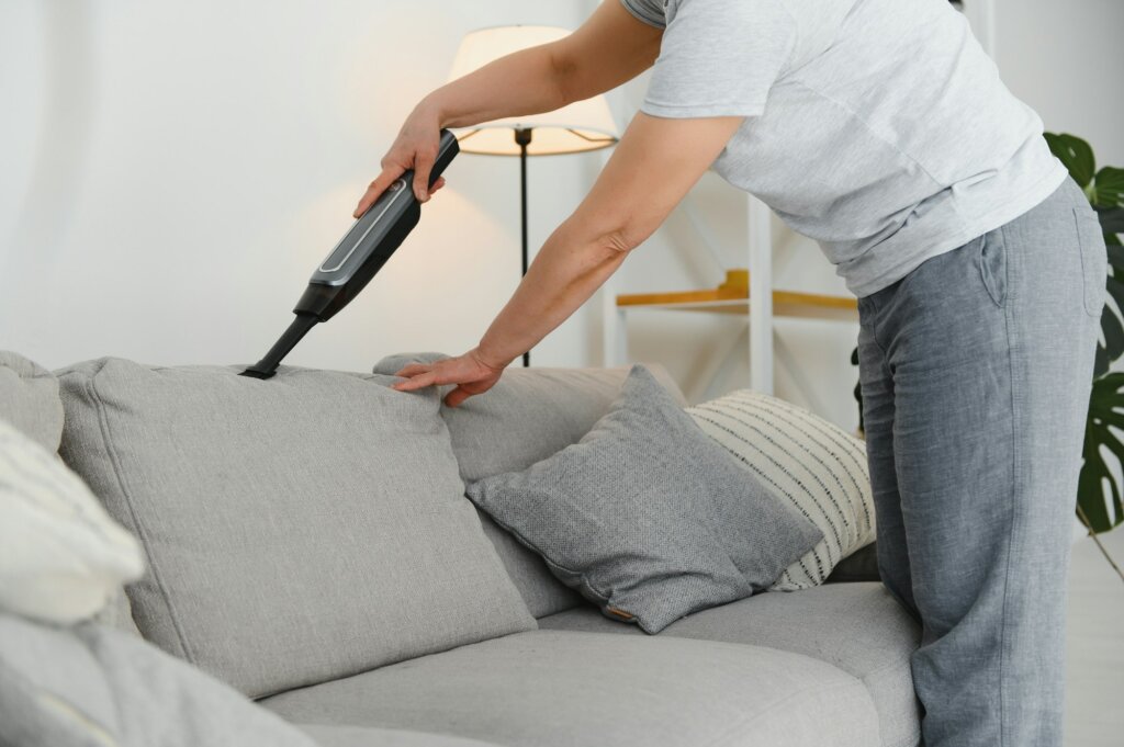 Middle-aged woman cleaning new apartment.